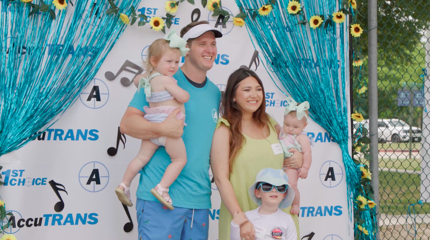 As one of the many 2023 AccuTRANS employee benefits, here is one family posing for a picture at the most recent AccuTRANS Family Day at the waterpark.