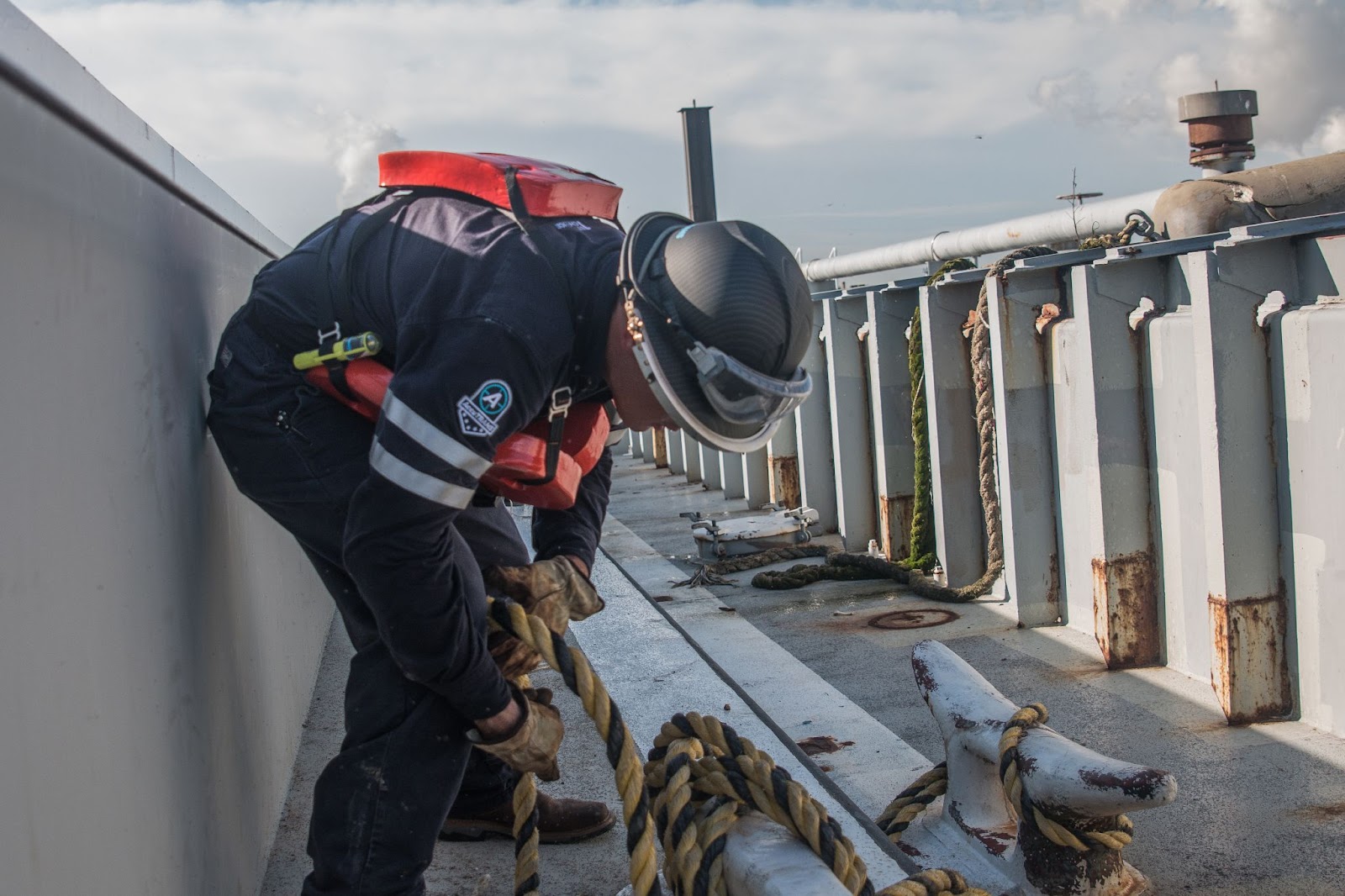 A man in uniform performing the tasks you can expect to perform when working tankerman jobs in Louisiana.